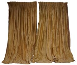 A PAIR OF YELLOW SILK CURTAINS AND TIE-BACKS (4)