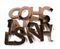 A GROUP OF FIFTEEN COPPER FINISHED METAL LETTER WALL LIGHTS (15)