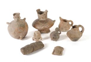 A PRE-COLUMBIAN POTTERY ZOOMORPHIC GLOBULAR EWER AND THREE OTHER VESSELS (8)