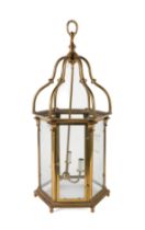 A BRASS HEXAGONAL THREE LIGHT HALL LANTERN