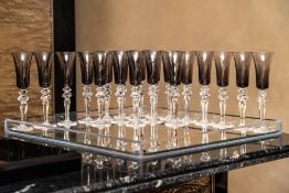 SAINT-LOUIS; A SET OF TWENTY GLASS 'EXCESS' PATTERN CHAMPAGNE FLUTES (20)