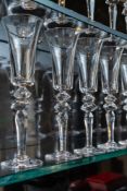SAINT-LOUIS; A SET OF TWELVE EXCESS PATTERN GLASS CHAMPAGNE FLUTES (12)
