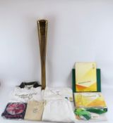 A London 2012 Olympic Games torch with uniform and associated paperwork. The gilt aluminium torch