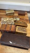 Collection of nine decorative trinket boxes and a boomerang