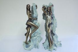 Pair of bronzed resin figural sculptures