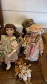 Set of four porcelain collector dolls