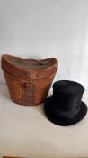 Black silk plush top hat by Buckley & Procter, Oldham, with leather hat case