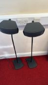 Pair of Bose speakers on floor stands