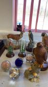 Group of wildlife figures, glass dome floral ornaments and paperweights