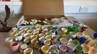 Collection of novelty ceramic egg cups and figural tablewares