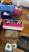 Group of vintage cameras and boxed mugs with novelty ornament
