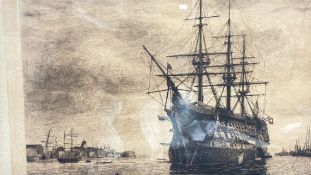 Framed maritime etching of a man-of-war at anchor