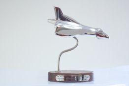 Chrome vulcan bomber on wooden base