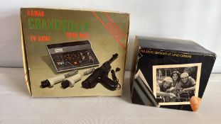 Two boxed vintage electronics: Adman Grandstand 3600 MKII TV game and Polaroid Swinger EE Land