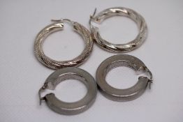 2 Pairs of silver earrings