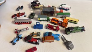 Group of die-cast model vehicles including cars, lorries, buses and locomotive