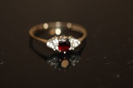 9ct Gold ring set with garnet & clear stones Weigh