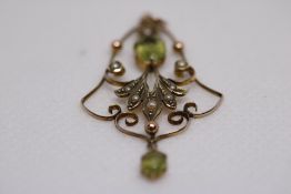 Yellow metal art nouveau pendant set with peridot