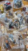 Collection of bagged Star Wars action figures and accessories
