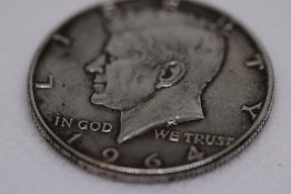 1964 Liberty Kennedy silver dollar