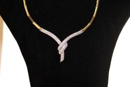 9ct Gold necklace set with multiple diamonds Total