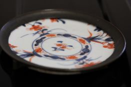 Oriental ceramic & brass plaque