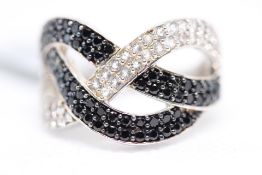 Sterling silver ring set with black spinal & white