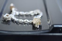 Silver curb link bracelet & 3 large charms Weight