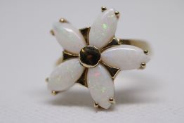 9ct Gold ring in the form of a flower set with 5 o