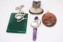 4 Silver/white metal pendants set with hardstone