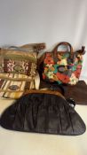 Group of Fossil handbags and black leather clutch