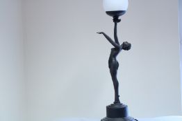 Art Deco style figural table lamp modelled as a resin female nude, standing on a stepped circular