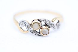 Yellow metal ring set with diamonds & opals Weight