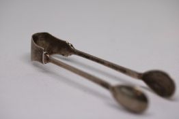 Pair of small silver sugar tongs