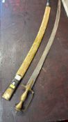 Curved etched sabre with brass hilt and fabric-covered scabbard