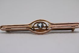 Yellow metal pin brooch set with blue stone Weight