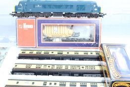 Set of 4 OO-gauge model railway items including BR diesel locomotive 45 039, three coaches and a