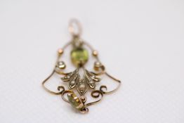 9ct Gold art nouveau pendant set with peridot & se