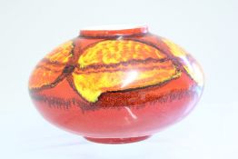 A Poole Pottery stoneware bowl-shaped vase, red ground with orange and yellow pooled-glaze panels