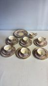 Group of English porcelain tea wares with floral and gilt decoration, marked â€œE & C. England, Bury