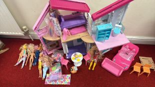 A group of dolls to include Barbie with folding Barbie dollhouse, toy convertible and accessories