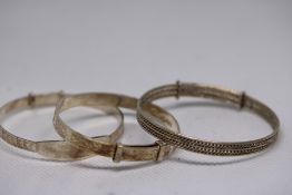 2 Silver bangles & 1 white metal bangle Weight 18.