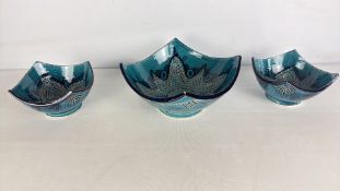 A group of turquoise glazed ceramic bowls with sgraffito decoration