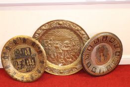 Group of Egyptian-style and embossed decorative metal wall plates