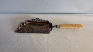 Silver-plated crumb tray with carved ivory-coloured handle