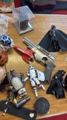A group of Star Wars action figures and accessories