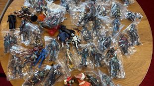 A group of bagged science-fiction action figures and accessories