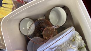 Group of assorted decorative and household items in boxes