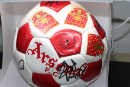 Arsenal football club team signed ball from the 19