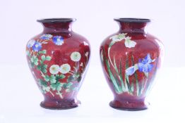 A pair of cloisonné vases, of ovoid baluster form with flared necks, the deep oxblood ground